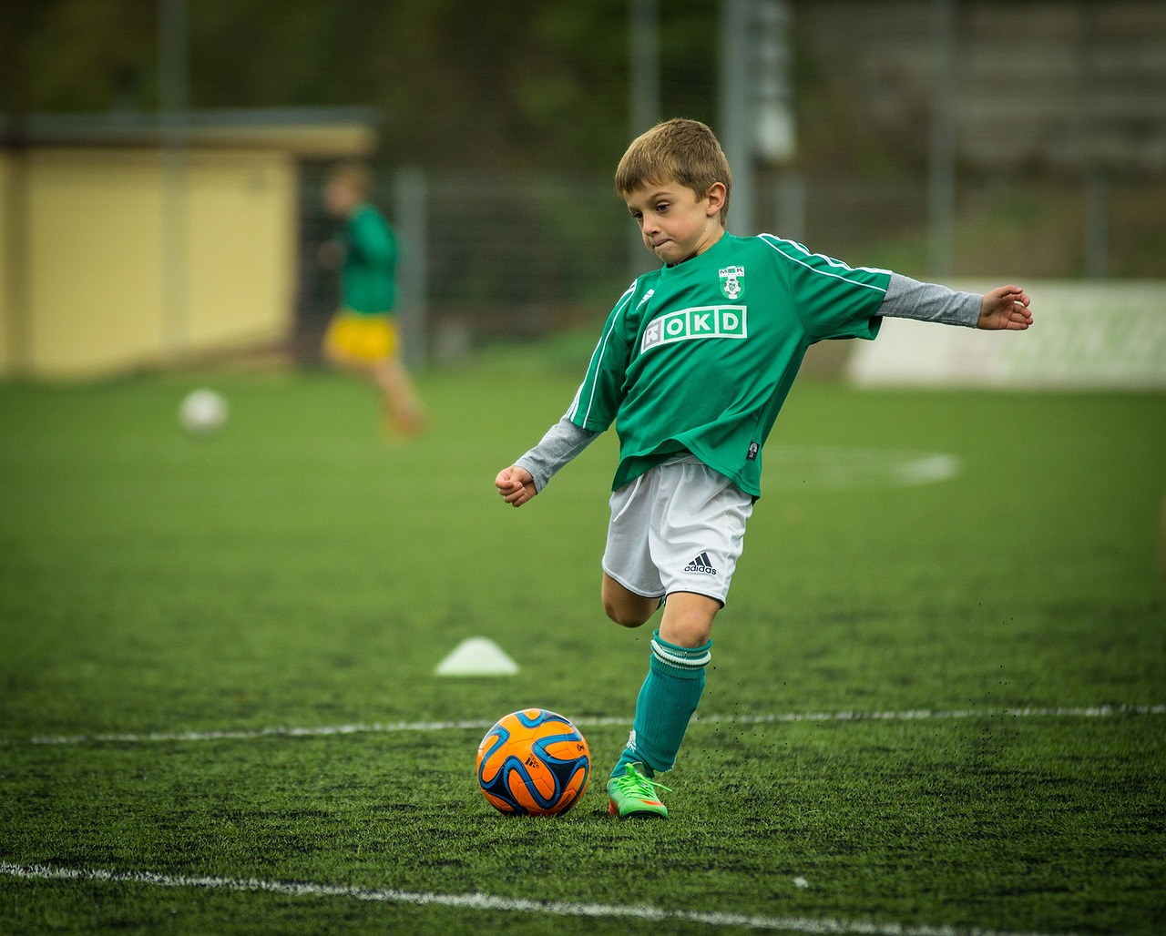child soccer playing kick 613199